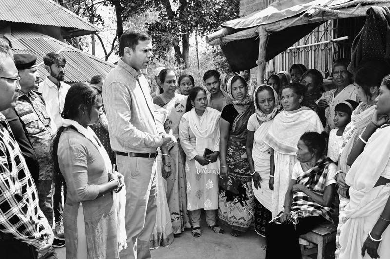 Innovative Water Supply System from Mining Pit - Deputy Commissioner Ravi Shankar Shukla with his team, interacting with the local community in Santal Tola